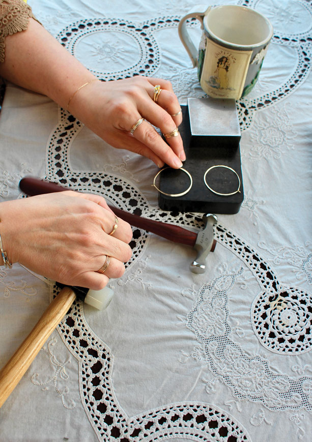 hands of a jeweler working on her jewelry