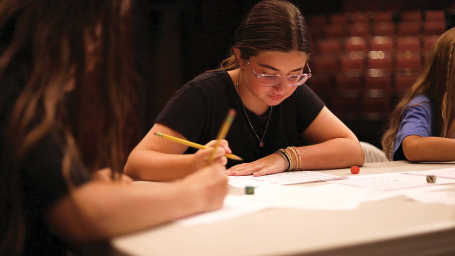 Two young actors read from a scrips