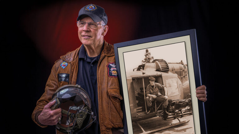 Vietnam veteran, Chief Warrant Officer Fred McCarthy left, holds photo of helicopter, right